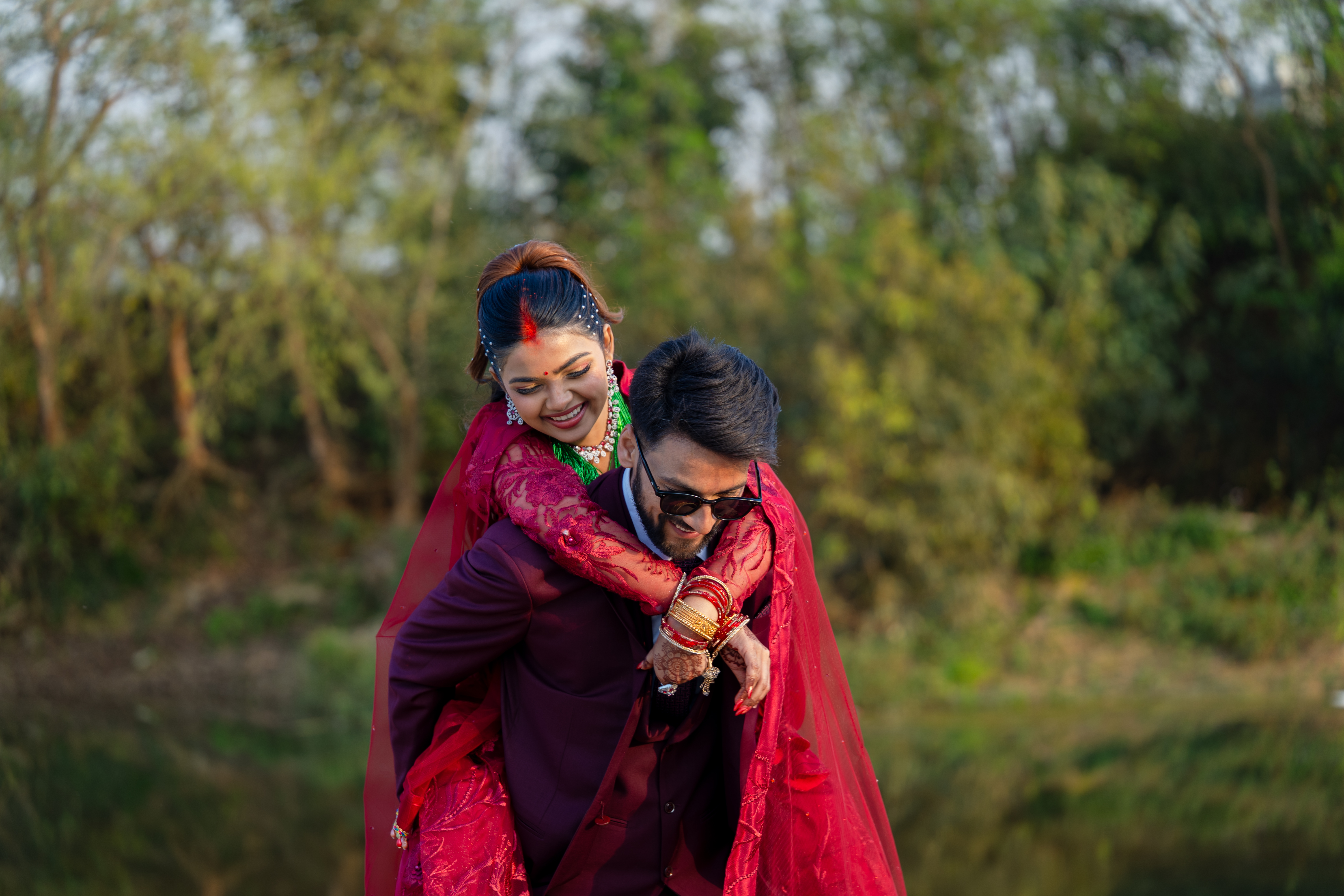 Guests throwing petals as a couple walks past